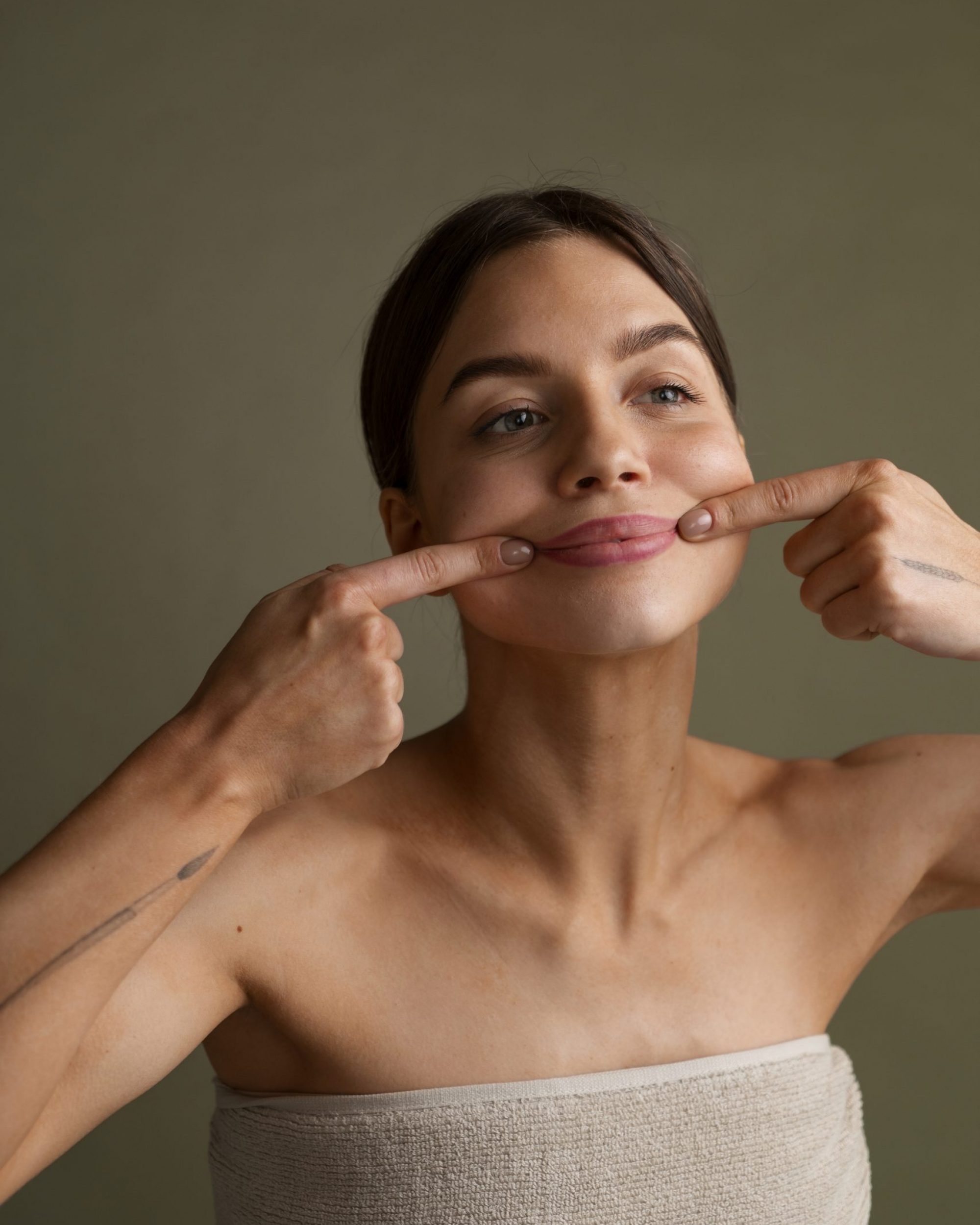 portrait-woman-trying-facial-yoga-massage-stay-young